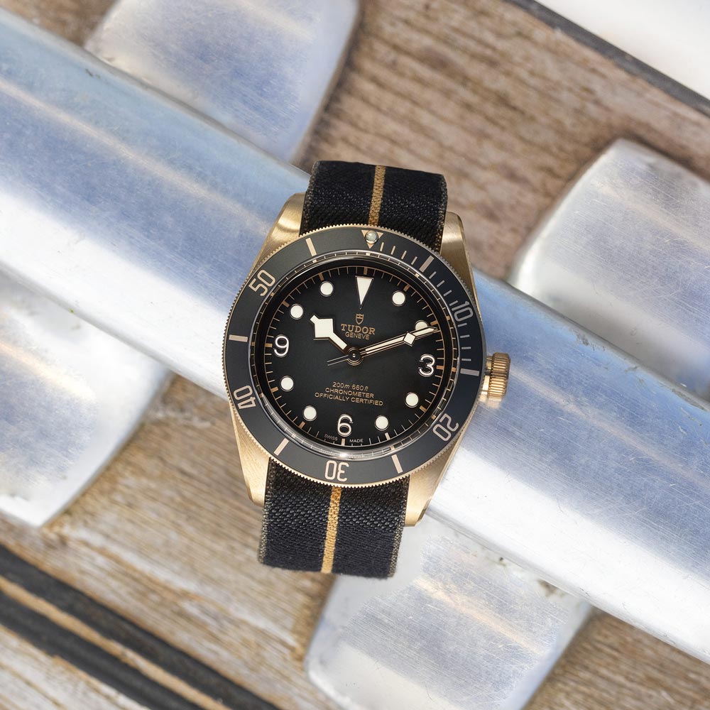 tudor black bay bronze 43mm slate grey dial bronze on fabric strap automatic watch lifestyle image