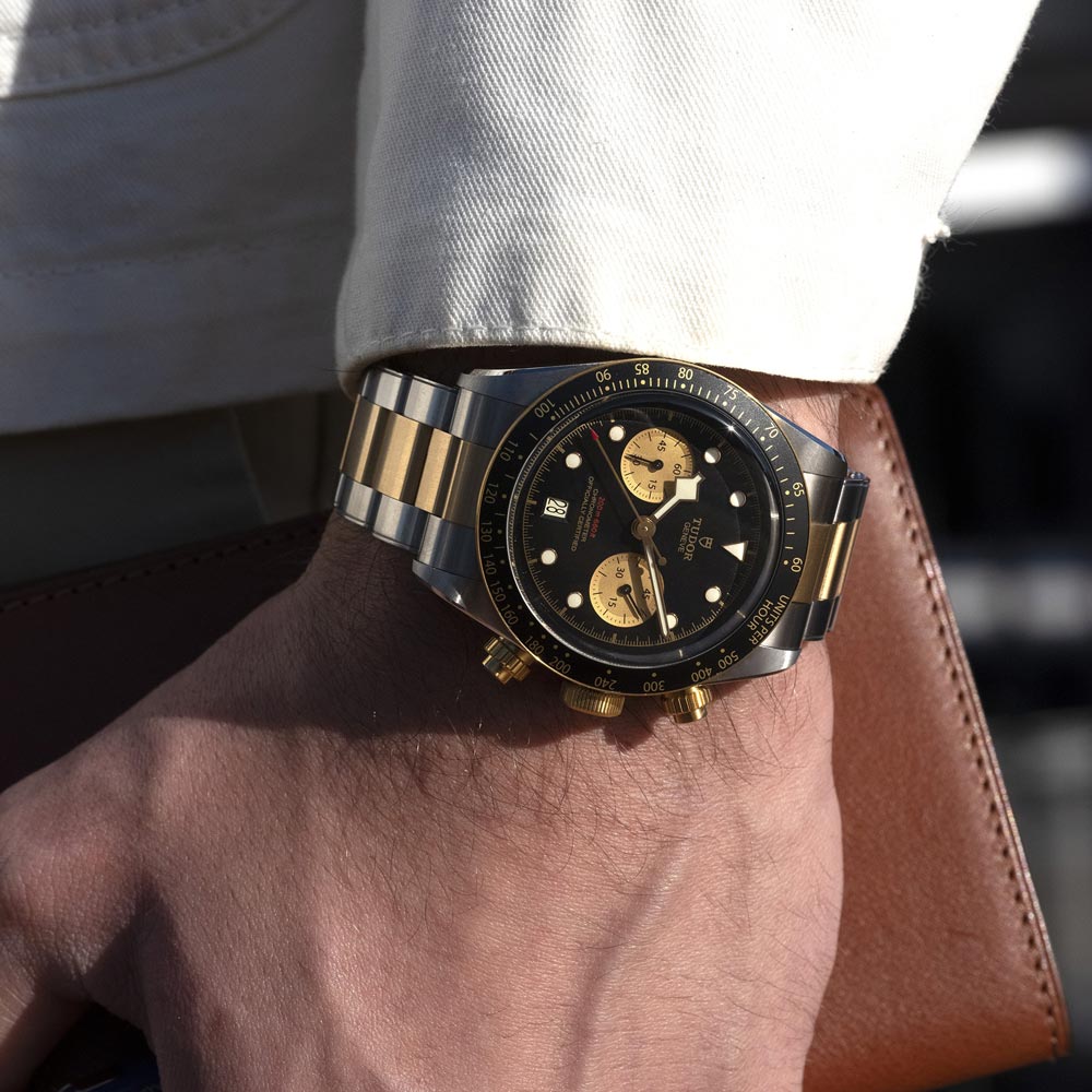 tudor black bay chrono s&g 41mm black dial gold and steel on steel and gold bracelet automatic chronograph watch lifestyle image
