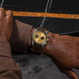 tudor black bay chrono s&g 41mm champagne dial gold and steel on leather strap automatic chronograph watch lifestyle image