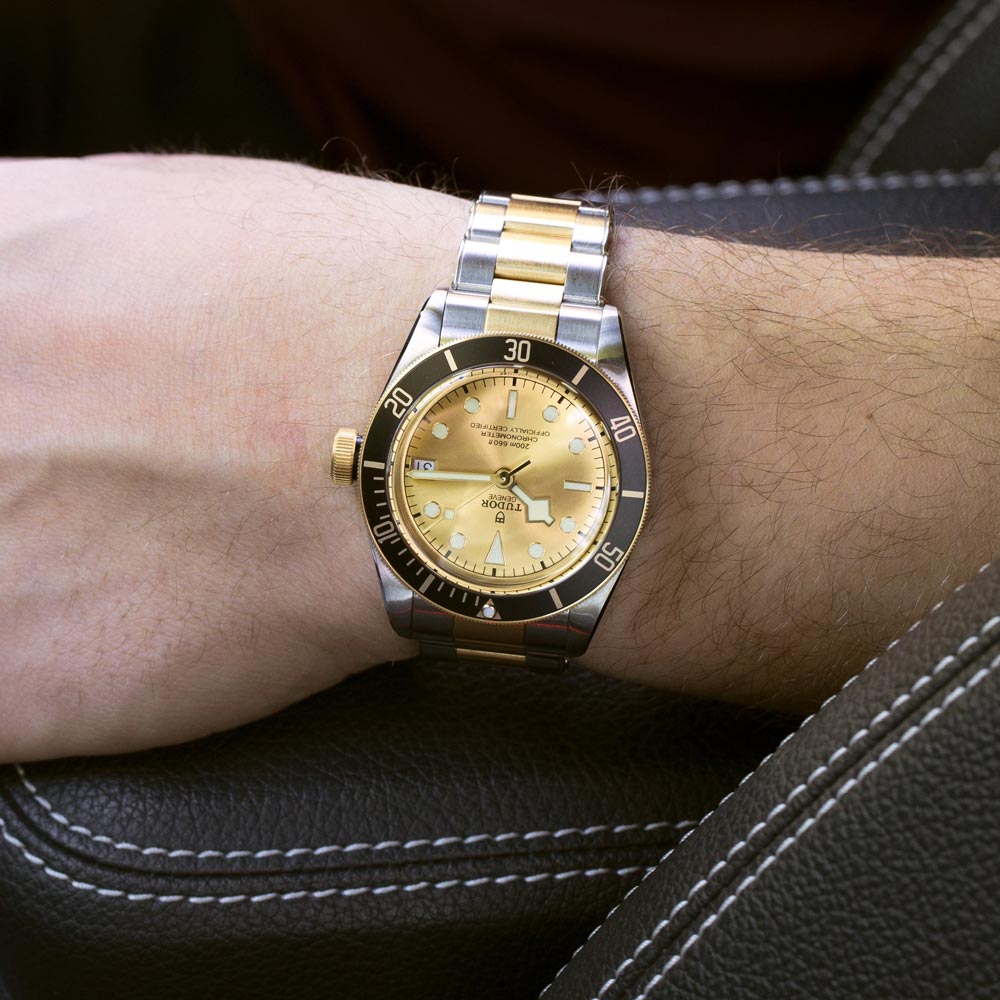 tudor black bay s&g 41mm champagne dial gold and steel on gold and steel bracelet automatic watch lifestyle image