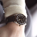 tudor black bay s&g 41mm black dial automatic gold and steel on leather strap watch lifestyle image
