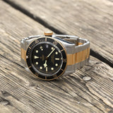 tudor black bay s&g 41mm black dial automatic gold and steel on gold and steel bracelet watch lifestyle image