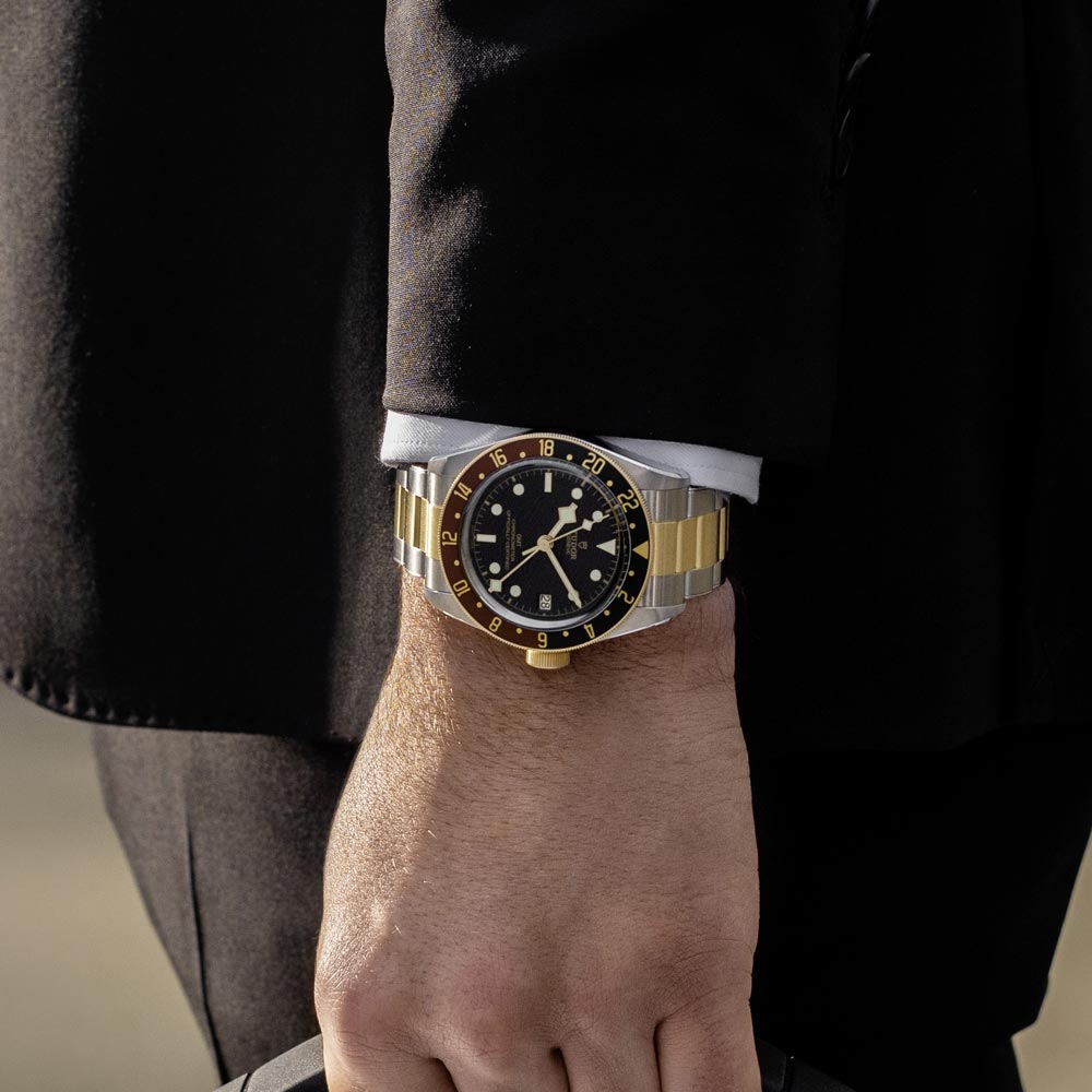 tudor black bay gmt s&g 41mm black dial gold and steel on gold and steel bracelet automatic watch lifestyle image