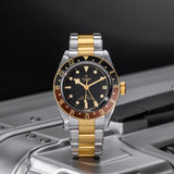 tudor black bay gmt s&g 41mm black dial gold and steel on gold and steel bracelet automatic watch lifestyle image