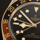tudor black bay gmt s&g 41mm black dial gold and steel on leather strap automatic watch lifestyle image