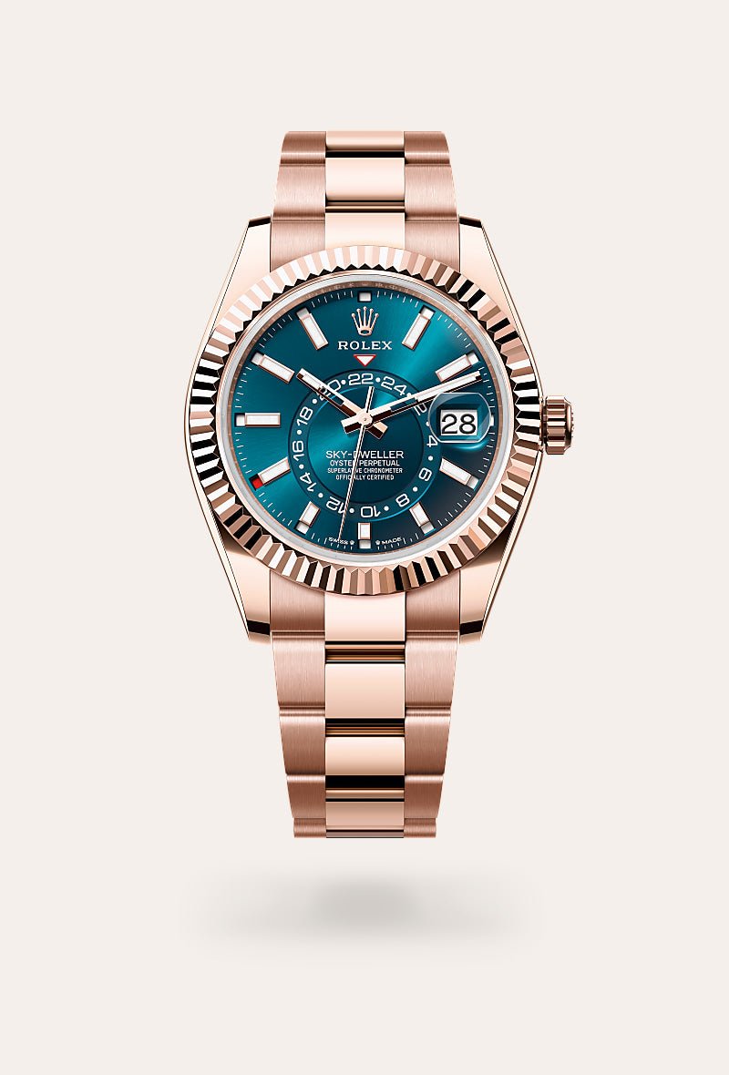 rolex sky-dweller, Rose gold watch with a blue dial on a white background upright image for desktop