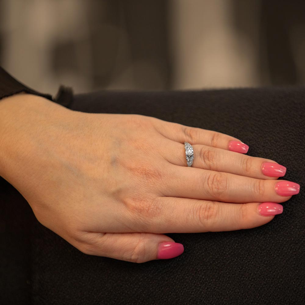 The Fleur Platinum Round Brilliant Cut Diamond Solitaire Engagement Ring With Diamond Leaf Detailing