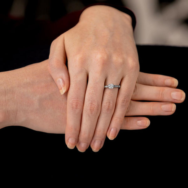 The Waterlily Platinum 0.55ct Cushion Cut Diamond Solitaire Engagement Ring With 0.21ct Diamond Set Shoulders