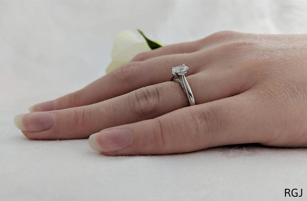 the oxford platinum oval cut diamond solitaire engagement ring with diamond detailing model shot
