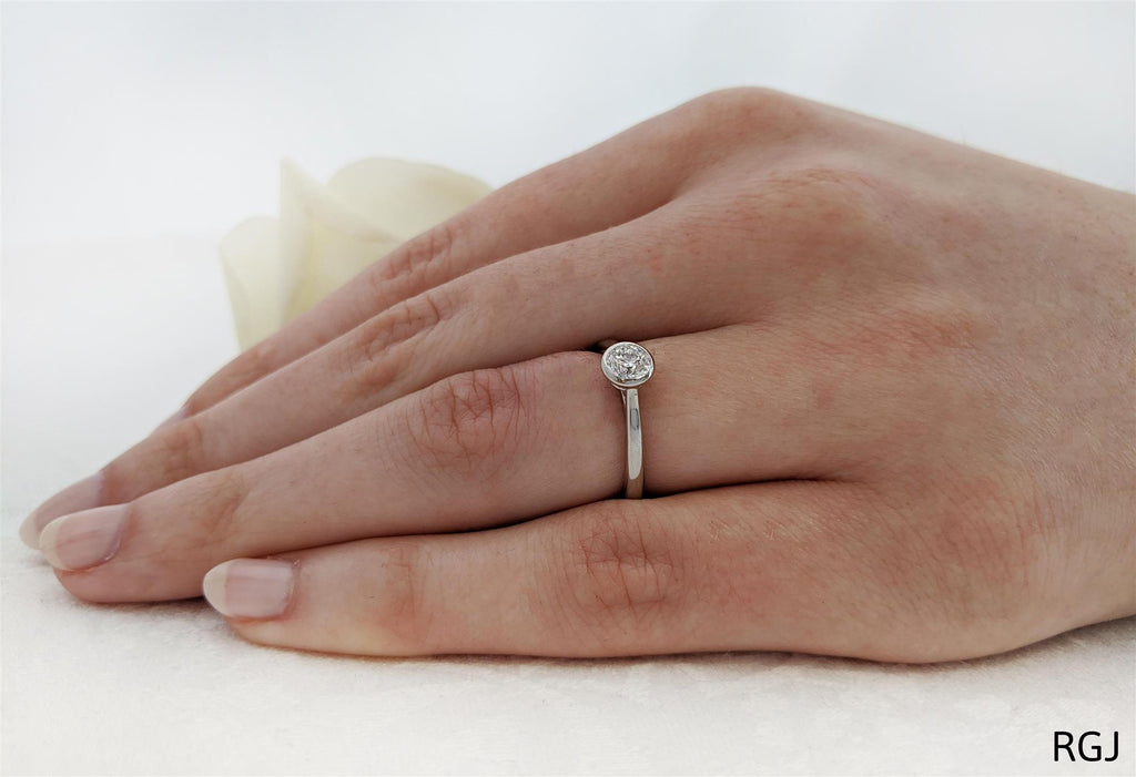 The Alena Platinum Round Brilliant Cut Diamond Solitaire Engagement Ring With Diamond Detailing