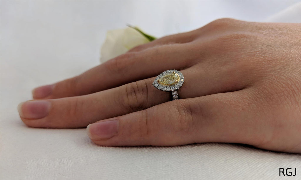 The Skye Platinum And 18ct Yellow Gold 0.39ct Pear Cut Yellow Diamond Engagement Ring With 0.27ct Diamond Halo And Diamond Set Shoulders