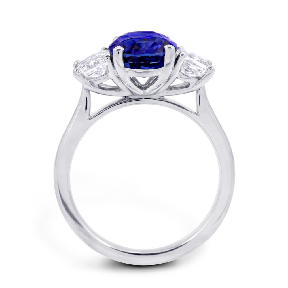 Platinum 3.16ct Oval Cut Sapphire And 1.06ct Radiant Cut Diamond Three Stone Ring