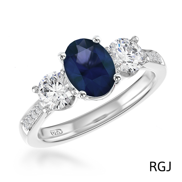 the memoire platinum 0.98ct oval cut blue sapphire and 0.55ct diamond three stone engagement ring with diamond set shoulders