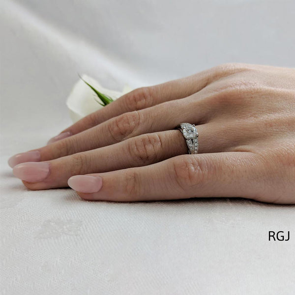 The Carrera Platinum Round Brilliant Cut Diamond Solitaire Engagement Ring With Diamond Set Twist Shoulders