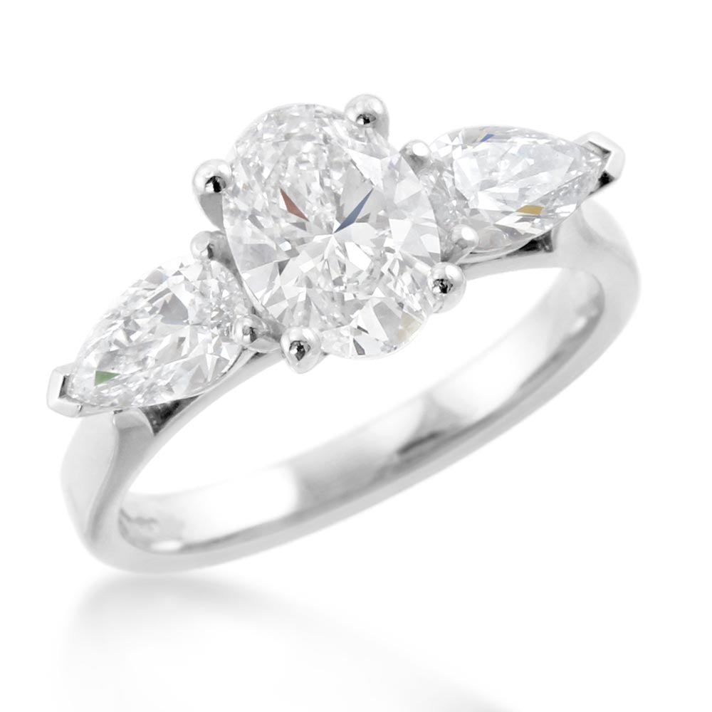 The Oval And Pear Cut Platinum Lab Grown Diamond Three Stone Engagement Ring