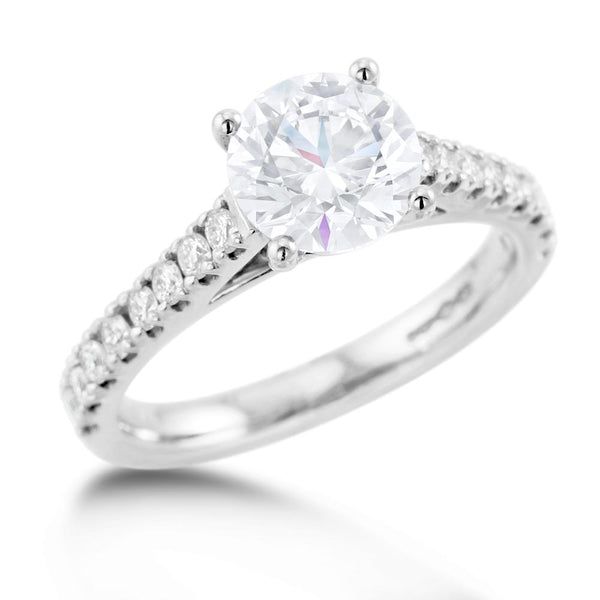 the round brilliant cut four claw platinum lab grown diamond solitaire engagement ring with natural diamond set shoulders