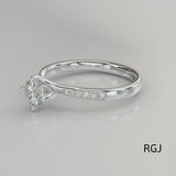 The Memoire Canna Platinum Round Brilliant Cut Diamond Solitaire Engagement Ring With Diamond Set Shoulders