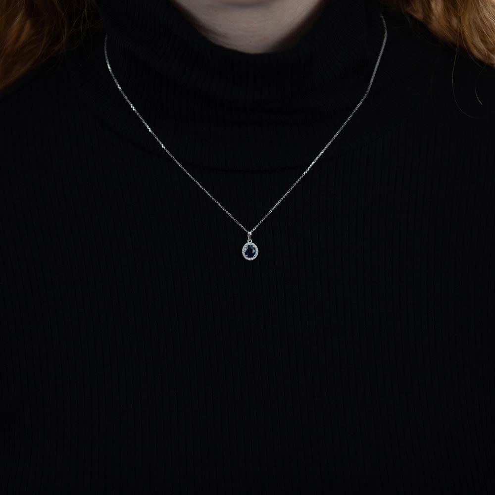 18ct White Gold 0.65ct Oval Sapphire and 0.10ct Diamond Halo Necklace