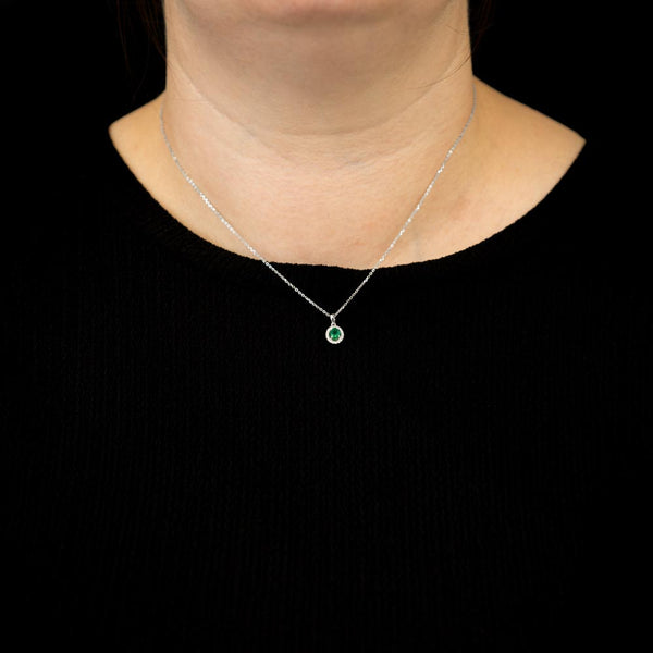 18ct white gold oval 0.40ct emerald and 0.10ct diamond necklace model shot