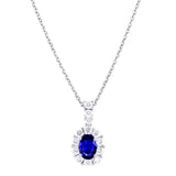 18ct White Gold 0.52ct Oval Cut Blue Sapphire and 0.41ct Diamond Pendant