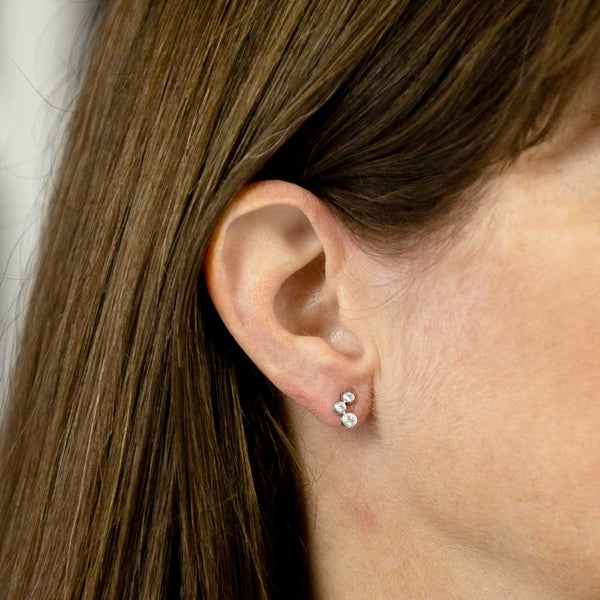 18ct white gold 0.22ct diamond trilogy stud earrings model shot