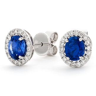 18ct white gold 0.84ct oval cut blue sapphire and 0.18ct diamond halo stud earrings