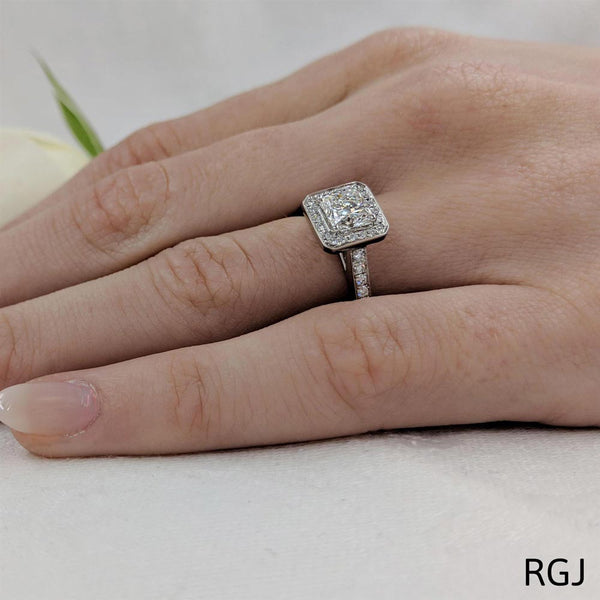 The Iona Platinum Radiant Cut Diamond Engagement Ring With Diamond Halo and Diamond Set Shoulders