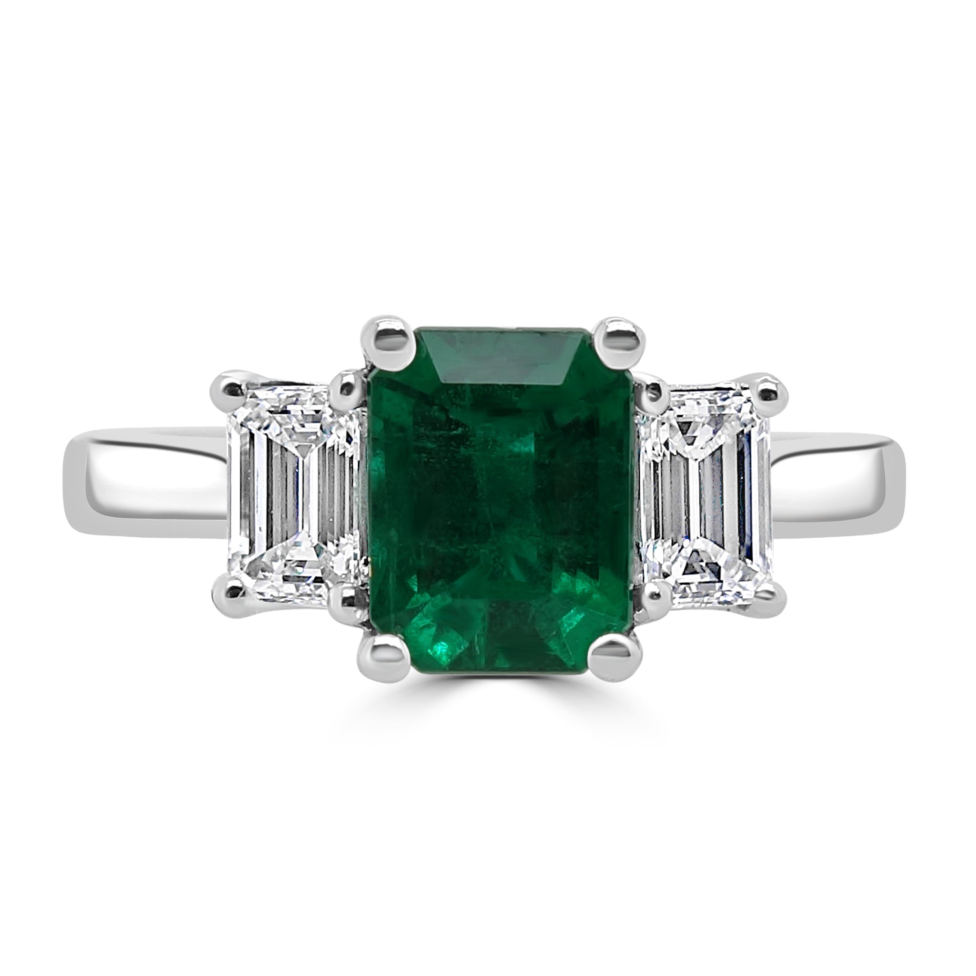 platinum 0.70ct emerald cut emerald and 0.46ct emerald cut diamond three stone engagement ring birds eye view