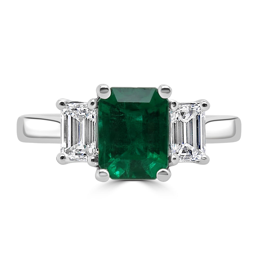 Platinum 0.70ct Emerald Cut Emerald And 0.46ct Emerald Cut Diamond Three Stone Engagement Ring