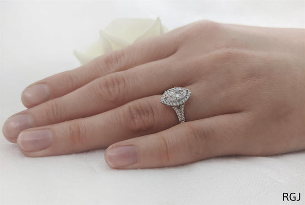 the skye saturn platinum marquise cut diamond engagement ring with diamond halo and diamond set split shoulders model shot