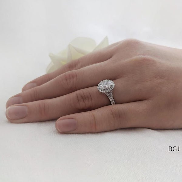 The Skye Saturn Platinum Oval Cut Diamond Engagement Ring With Diamond Halo And Diamond Set Shoulders