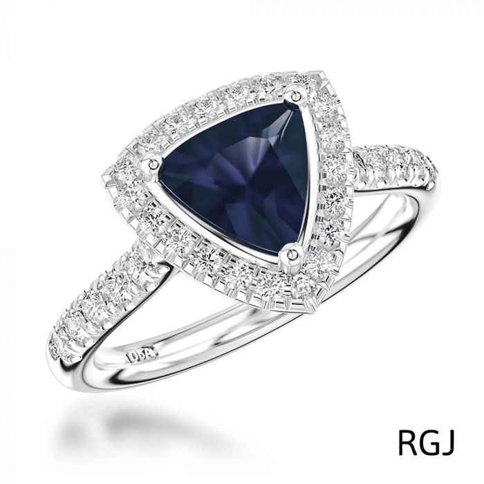 The Skye Platinum 0.84ct Trilliant Cut Blue Sapphire Ring With 0.33ct Diamond Halo And Diamond Set Shoulders