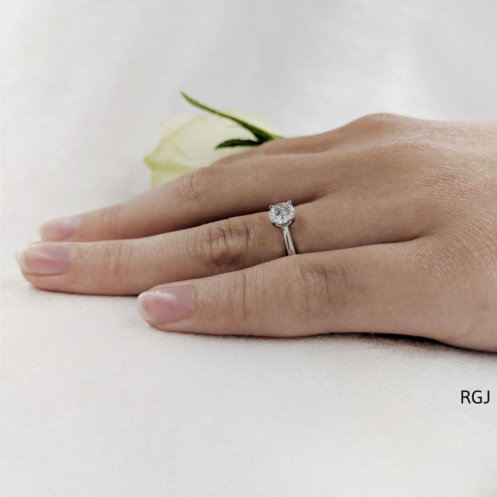 The Tulip Platinum Round Brilliant Cut Diamond Solitaire Engagement Ring