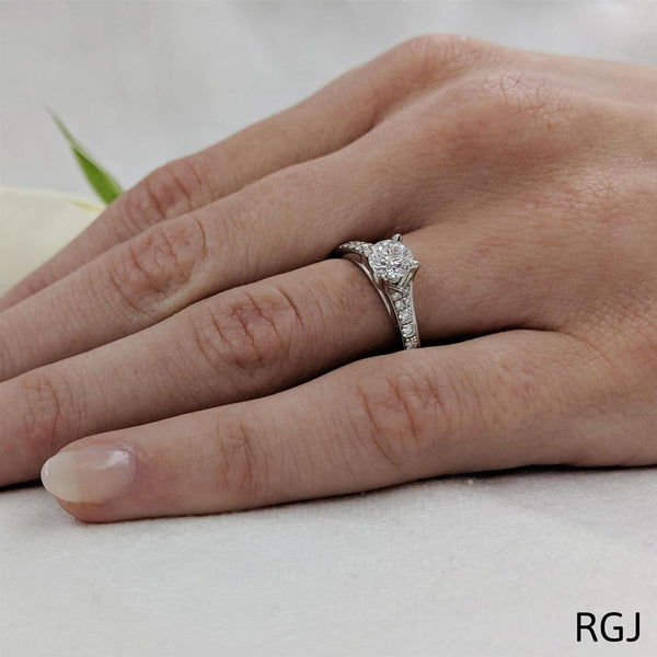 The Valentia Platinum Round Brilliant Cut Diamond Solitaire Engagement Ring With Diamond Set Shoulders
