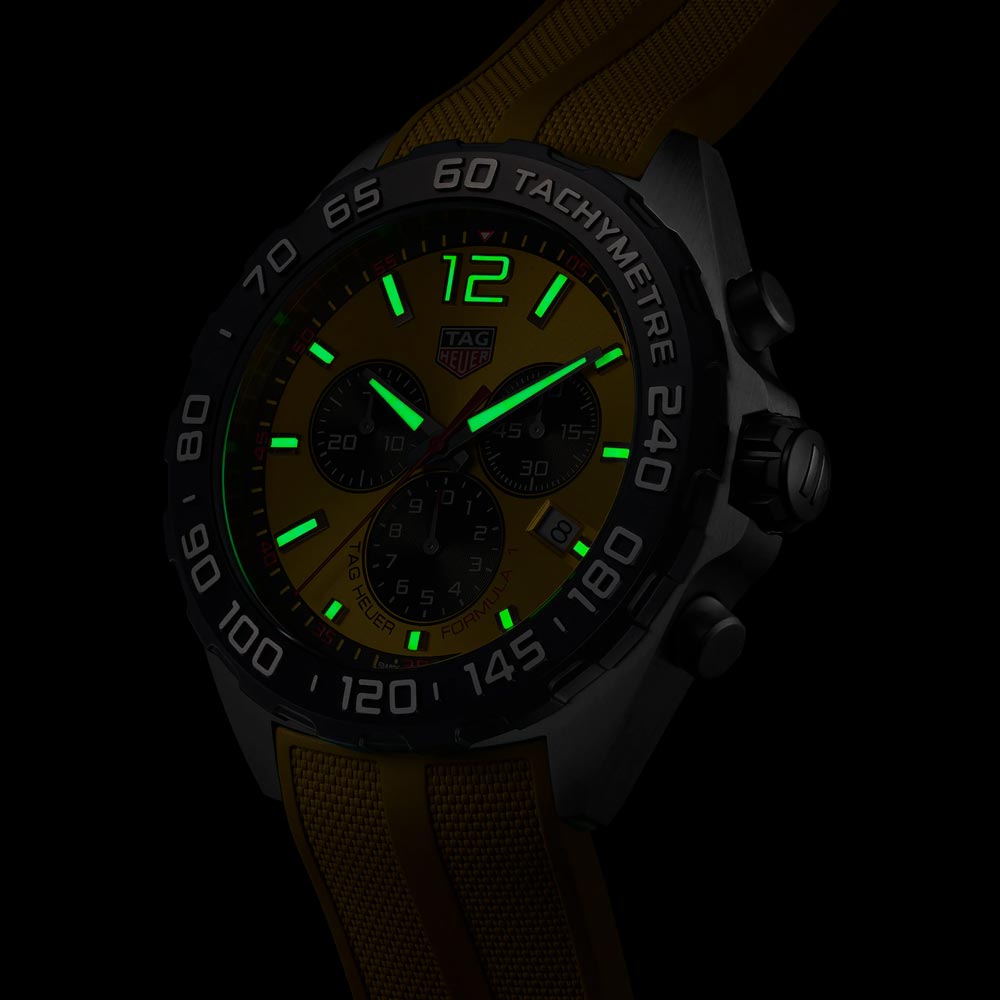 tag heuer formula 1 43mm yellow dial quartz chronograph gents watch in the dark shot