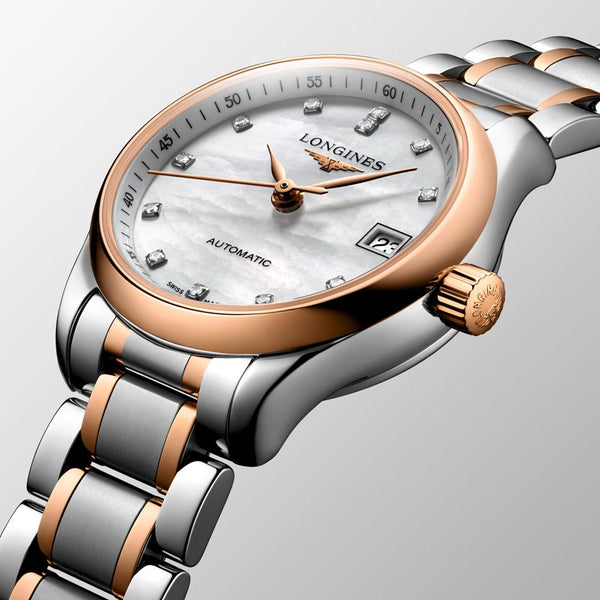 longines master collection 25.5mm mop diamond dot dial 18ct rose gold capped steel automatic ladies watch dial close up