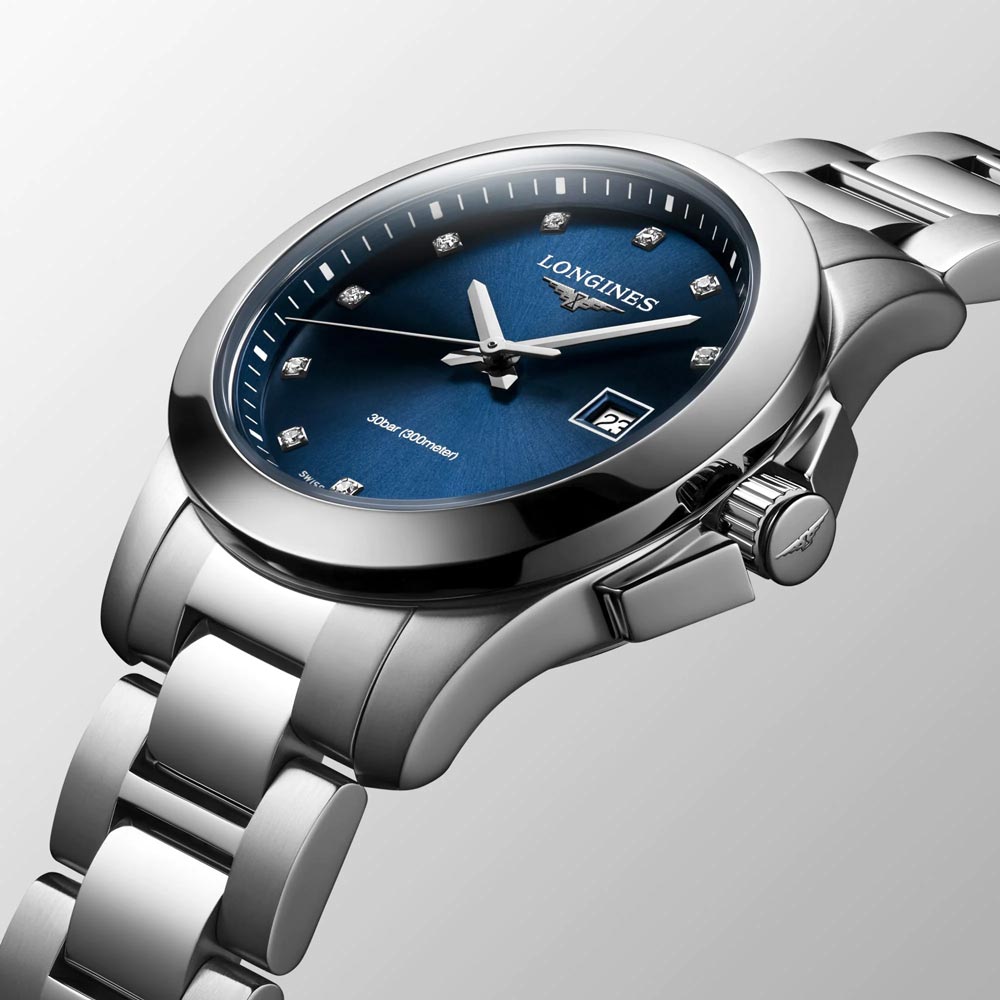 longines conquest classic 29.5mm blue diamond dot dial ladies quartz watch dial close up
