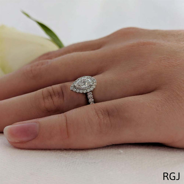 The Skye Platinum Pear Cut Diamond Engagement Ring With Diamond Halo And Diamond Set Shoulders
