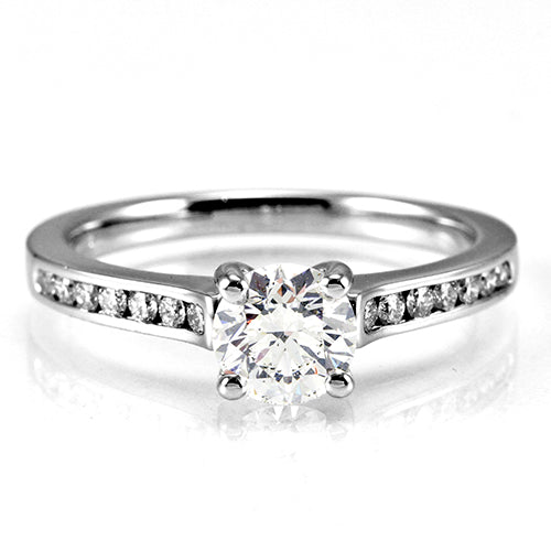 The Waterlily Platinum Round Brilliant Cut Diamond Solitaire Engagement Ring With Diamond Set Shoulders